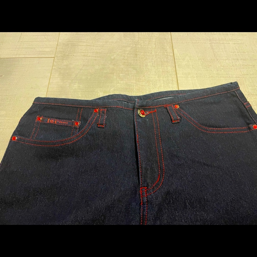 NWOT dark blue jeans with red threading